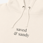 Close-up of Saved and Sandy center chest hoodie embroidery